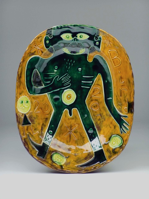 Relief plate with green man Bird