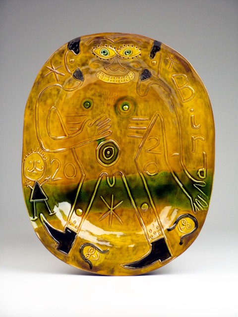 Relief plate with honey glaze Bird